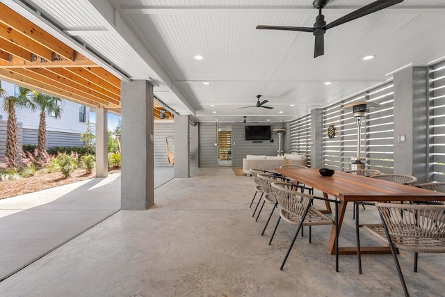 view of patio / terrace with outdoor dining area and a ceiling fan