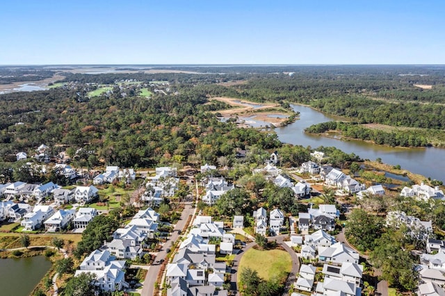 birds eye view of property featuring a residential view, a water view, and a view of trees