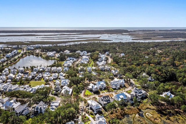 birds eye view of property with a water view and a residential view