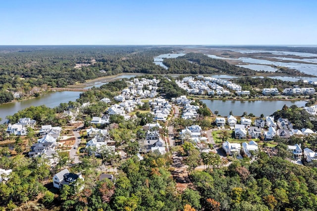 bird's eye view with a residential view, a wooded view, and a water view