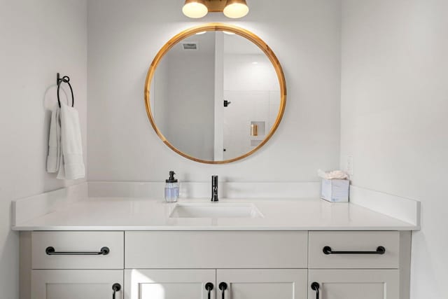 bathroom with vanity and visible vents