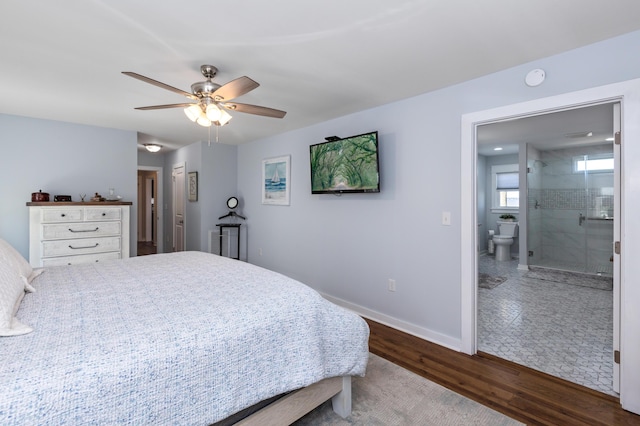 bedroom featuring ceiling fan, connected bathroom, baseboards, and wood finished floors