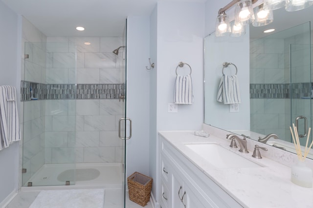 full bath featuring a stall shower, vanity, and recessed lighting