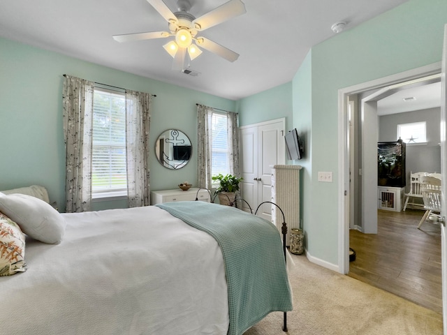 bedroom featuring light hardwood / wood-style flooring and ceiling fan