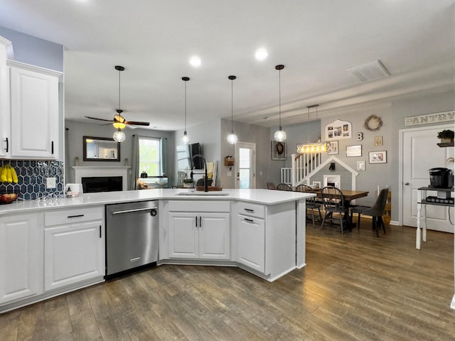 kitchen with white cabinetry, dark hardwood / wood-style flooring, sink, ceiling fan, and stainless steel dishwasher