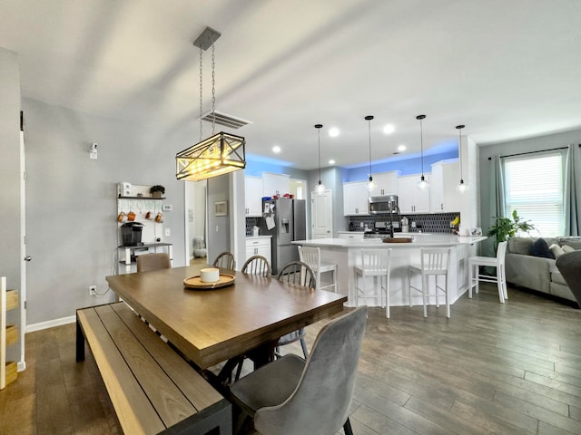 dining room featuring dark hardwood / wood-style flooring