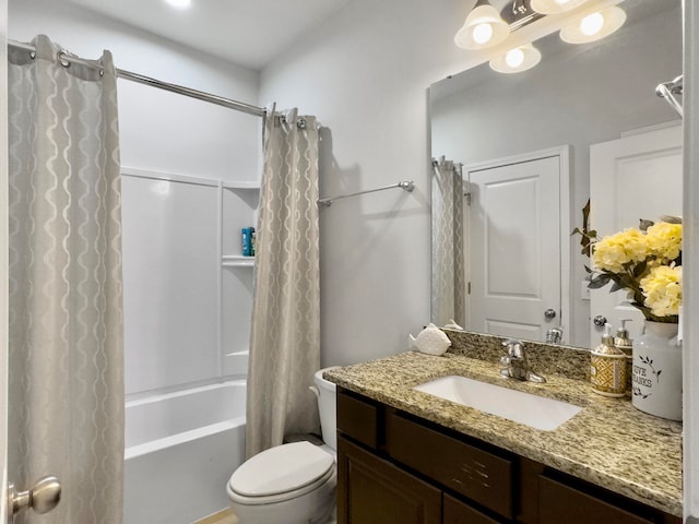 full bathroom with shower / bath combo with shower curtain, toilet, and vanity