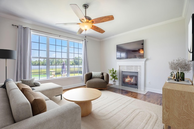 1713 Pimlico Blvd, Moncks Corner, SC 29461 - living area featuring wood finished floors, ornamental molding, baseboards, a premium fireplace, and a ceiling fan
