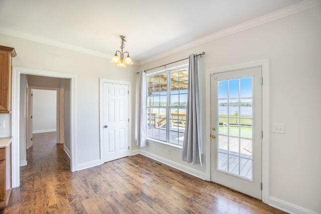 1713 Pimlico Blvd, Moncks Corner, SC 29461 - unfurnished dining area featuring a chandelier, wood finished floors, ornamental molding, baseboards, and a water view