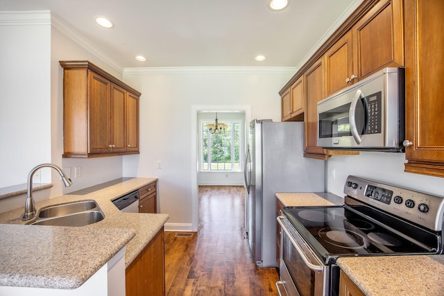1713 Pimlico Blvd, Moncks Corner, SC 29461 - kitchen with appliances with stainless steel finishes, a sink, brown cabinetry, dark wood-type flooring, and recessed lighting