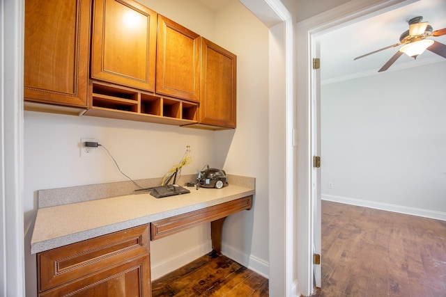 1713 Pimlico Blvd, Moncks Corner, SC 29461 - office featuring built in desk, a ceiling fan, dark wood-type flooring, baseboards, and ornamental molding