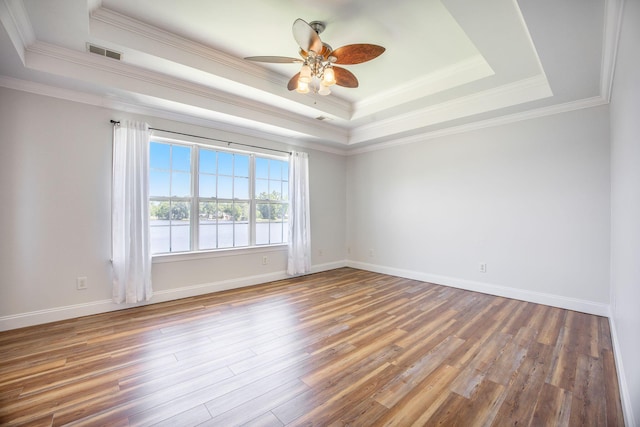 1713 Pimlico Blvd, Moncks Corner, SC 29461 - empty room with a raised ceiling, ceiling fan, wood finished floors, ornamental molding, and baseboards