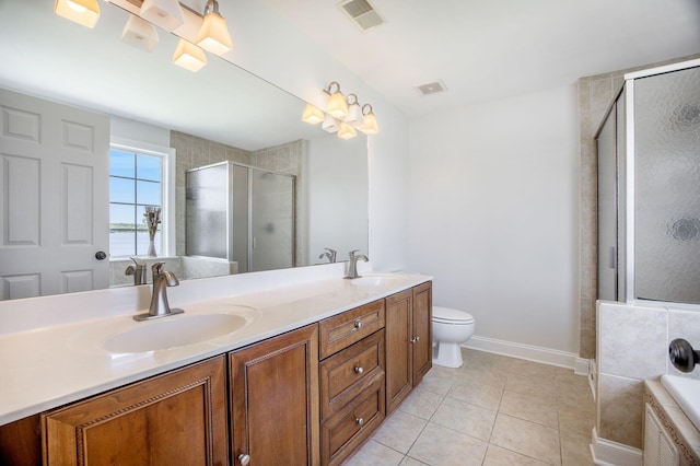1713 Pimlico Blvd, Moncks Corner, SC 29461 - bathroom featuring double vanity, a shower stall, a bath, tile patterned flooring, and toilet