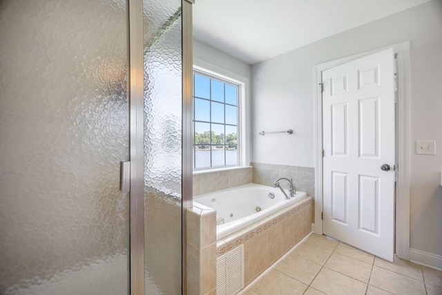 1713 Pimlico Blvd, Moncks Corner, SC 29461 - bathroom featuring tile patterned flooring, a whirlpool tub, a stall shower, and a water view