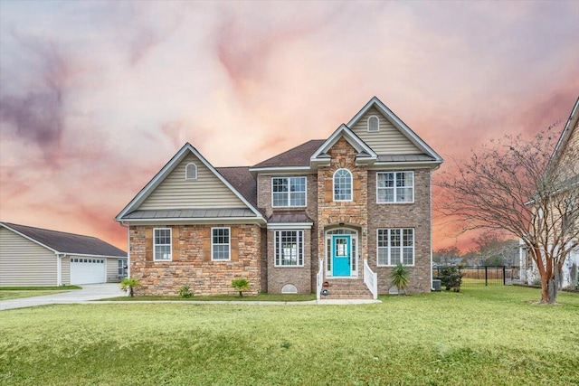 1713 Pimlico Blvd, Moncks Corner, SC 29461 - traditional home featuring stone siding, an outbuilding, a standing seam roof, and a detached garage