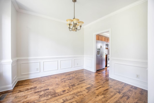 1713 Pimlico Blvd, Moncks Corner, SC 29461 - unfurnished room with a chandelier, ornamental molding, wood finished floors, and wainscoting