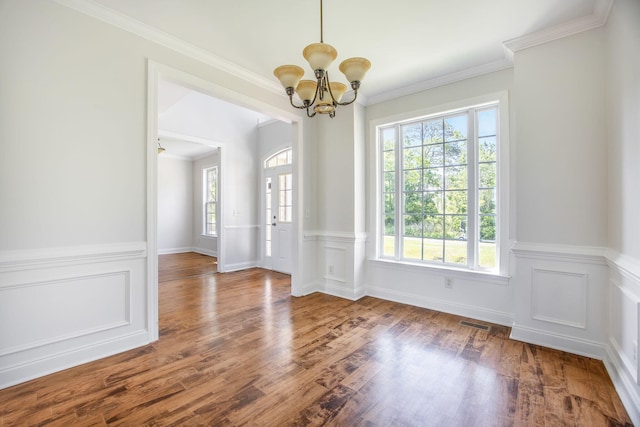 1713 Pimlico Blvd, Moncks Corner, SC 29461 - unfurnished dining area with a chandelier, wainscoting, wood finished floors, and ornamental molding