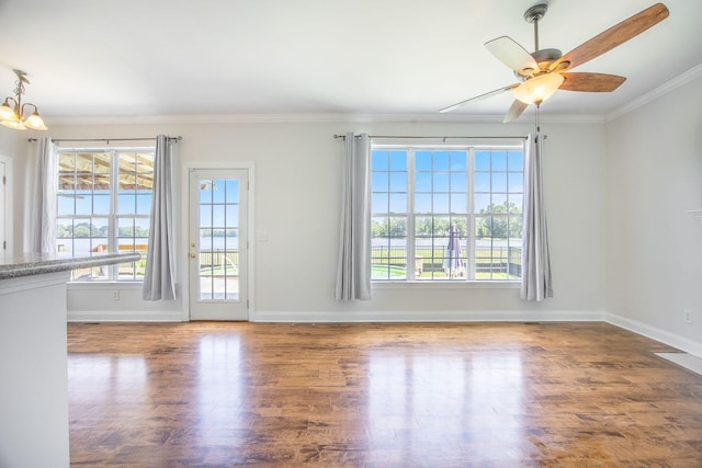 1713 Pimlico Blvd, Moncks Corner, SC 29461 - unfurnished living room with plenty of natural light, wood finished floors, baseboards, and ornamental molding