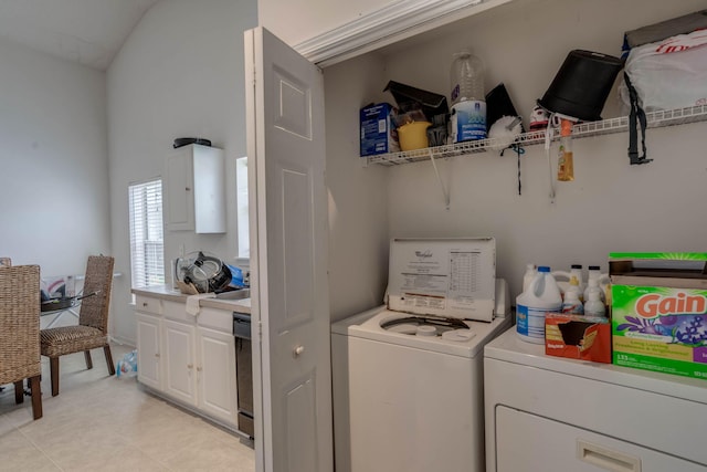 laundry room featuring laundry area, light tile patterned flooring, and independent washer and dryer