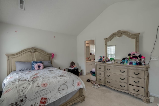 bedroom with ensuite bath, visible vents, light colored carpet, and high vaulted ceiling
