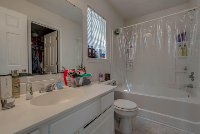 full bathroom with shower / tub combo with curtain, tile patterned flooring, toilet, and vanity
