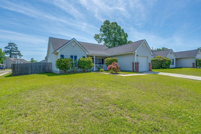 ranch-style house featuring concrete driveway, a front yard, fence, and a garage