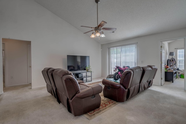 living room with a textured ceiling, light carpet, ceiling fan, and high vaulted ceiling