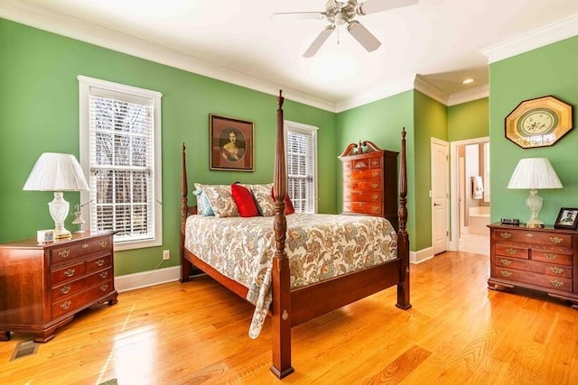 bedroom with light wood finished floors, baseboards, a ceiling fan, connected bathroom, and crown molding