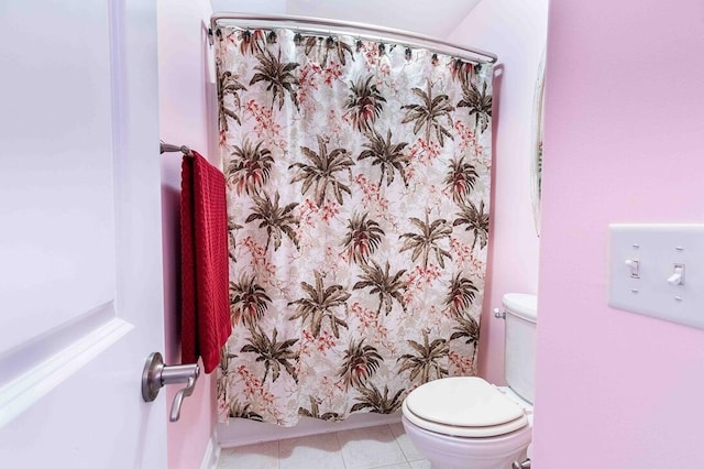 full bathroom with tile patterned flooring, a shower with shower curtain, and toilet