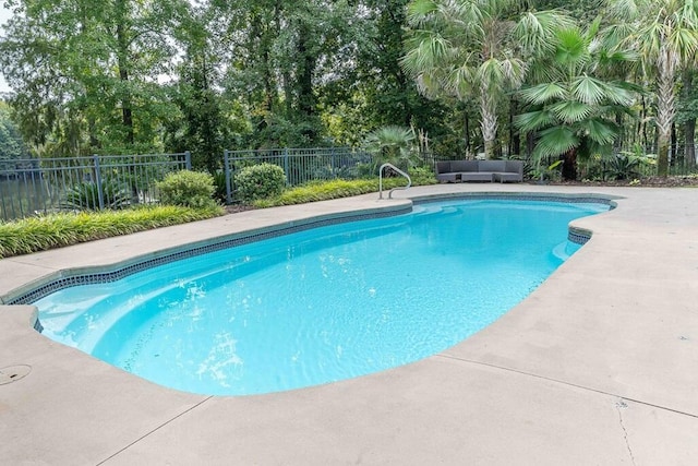 view of swimming pool with a patio area, a fenced backyard, outdoor lounge area, and a fenced in pool