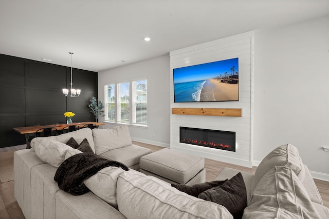 238 Bird Song Path, Summerville, SC 29485 - living room featuring baseboards, a fireplace, wood finished floors, a chandelier, and recessed lighting