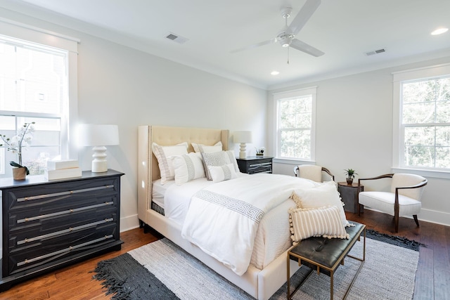 bedroom with recessed lighting, dark wood-style flooring, and visible vents