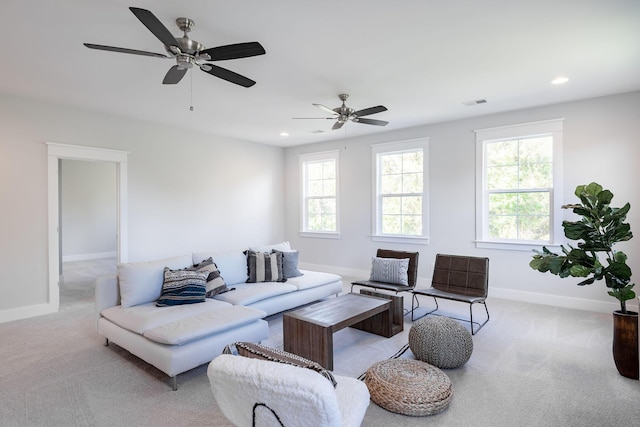 living room featuring carpet floors, recessed lighting, plenty of natural light, and baseboards