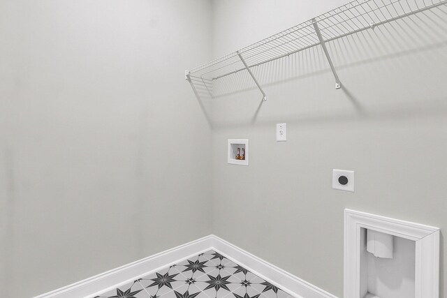 laundry room featuring light floors, hookup for a washing machine, hookup for an electric dryer, laundry area, and baseboards