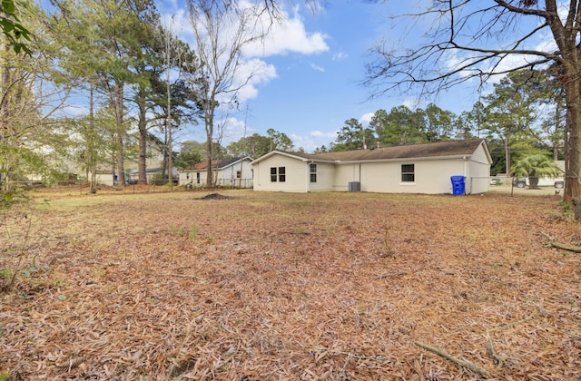 rear view of property with fence