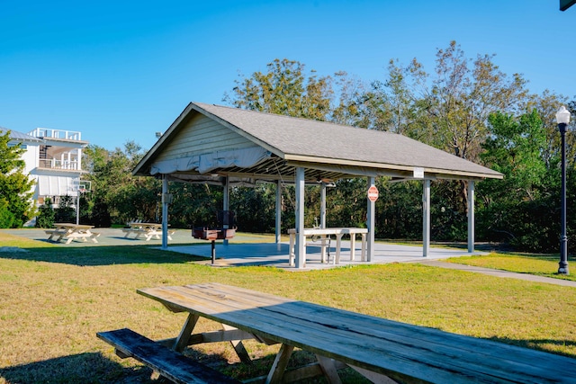 view of home's community with a patio, a gazebo, and a lawn