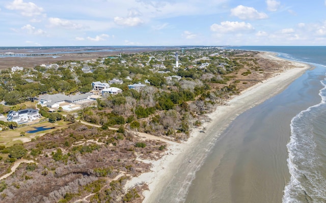 bird's eye view featuring a water view and a beach view