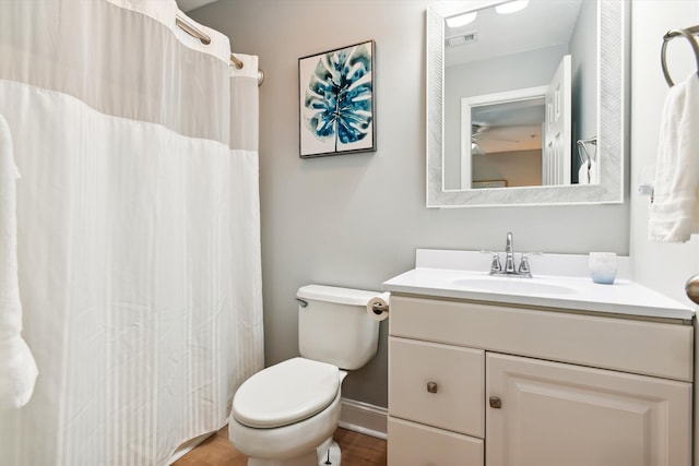 bathroom featuring toilet and vanity