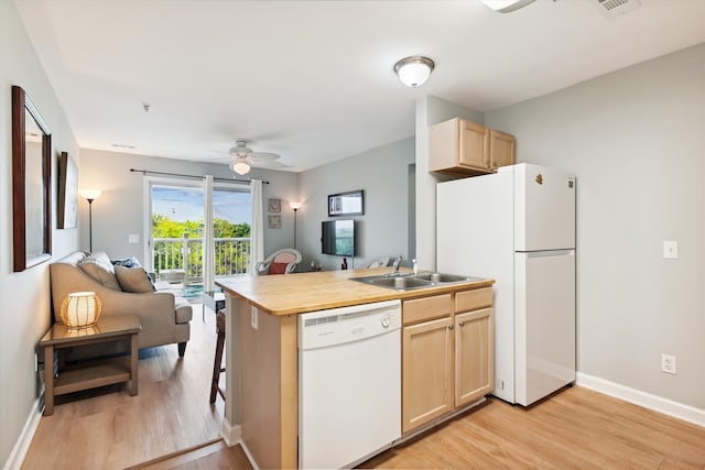 kitchen featuring dishwasher, ceiling fan, fridge, and light hardwood / wood-style flooring