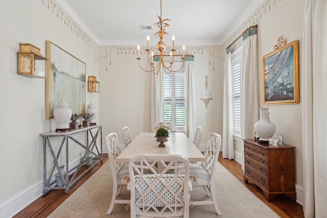 28 Robert Mills Cir, Mount Pleasant, SC 29464 - dining space featuring a chandelier, wood finished floors, baseboards, and crown molding
