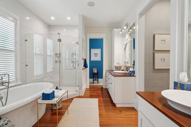 28 Robert Mills Cir, Mount Pleasant, SC 29464 - full bath with two vanities, a shower stall, wood finished floors, a soaking tub, and crown molding