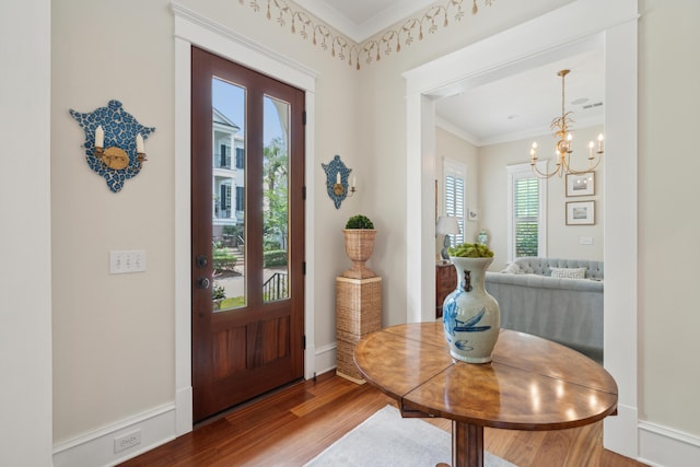 28 Robert Mills Cir, Mount Pleasant, SC 29464 - entrance foyer with ornamental molding, wood finished floors, and a chandelier