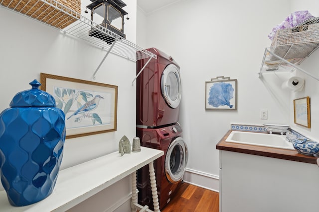 28 Robert Mills Cir, Mount Pleasant, SC 29464 - washroom with estacked washer and dryer, dark wood-type flooring, ornamental molding, and baseboards