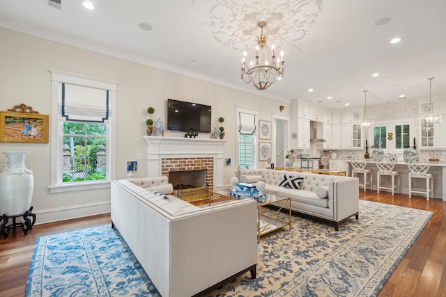 28 Robert Mills Cir, Mount Pleasant, SC 29464 - living room with a chandelier, a fireplace, recessed lighting, wood finished floors, and baseboards