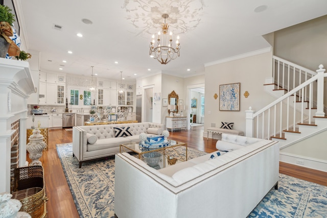28 Robert Mills Cir, Mount Pleasant, SC 29464 - living area with light wood-type flooring, stairway, recessed lighting, a chandelier, and crown molding