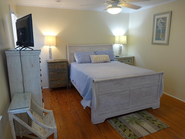 1001 Palmetto Blvd, Edisto Island, SC 29438 - bedroom with ornamental molding, wood finished floors, and a ceiling fan