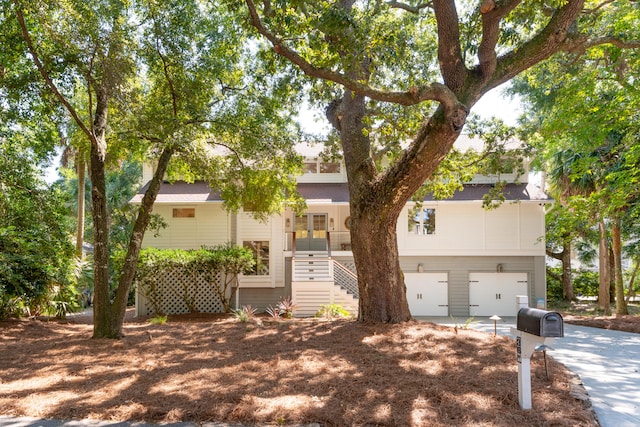 view of front of home featuring covered porch and a garage