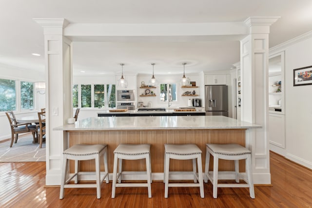 kitchen featuring light wood-type flooring, white cabinetry, and stainless steel refrigerator with ice dispenser