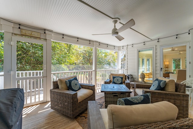 sunroom / solarium with a wealth of natural light and ceiling fan