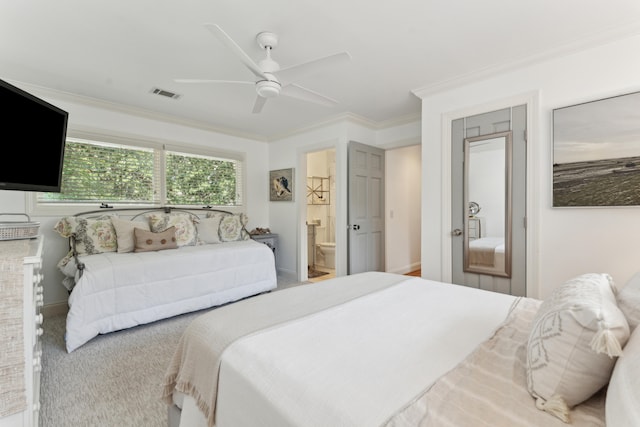 carpeted bedroom featuring connected bathroom, ceiling fan, and crown molding